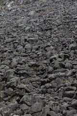 Lead ore waste rocks with galena at Miners Village in Glendalough, Ireland