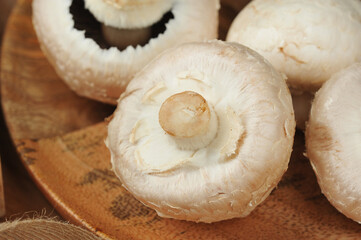 whole mushrooms on a wooden background