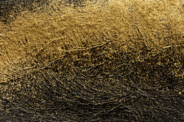 Macro texture of black acrylic paint with gold shimmer