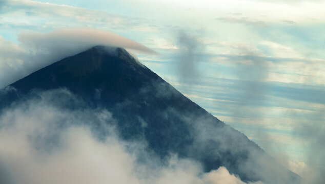 The Gamalama Stratovolcano is higher than the clouds, smokes (effervescent springs) and overcast (volcanic cloud). Ternate