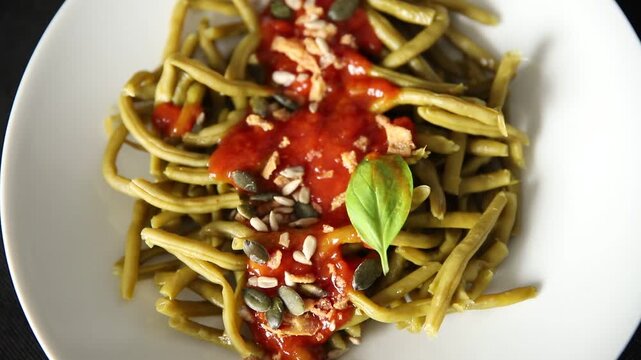 Green string beans tomato sauce main course natural food product appetizer tasty snack fresh delicious gourmet food background on the table rustic food top view copy space keto and paleo diet vegetari