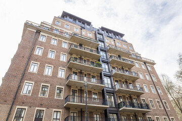 Urban Apartment Building Exterior With Brick Facade