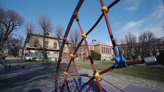 Modern children's playground with climbing structures located in a city park on a sunny morning in Zagreb