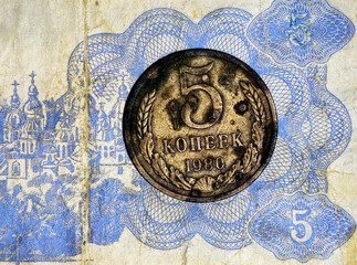 Close-up of a vintage Soviet five kopeks coin from 1980 placed on an old USSR banknote, symbolizing Soviet currency, history, economy, and retro money design.