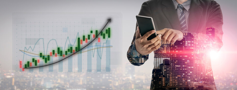 A business professional interacts with a smartphone while viewing financial data against a city skyline, emphasizing growth and analysis in modern commerce. Impute - Powered by Adobe