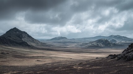 Dramatic cloudy landscape with rugged mountains and vast open plains