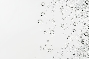 Close-up of effervescent soda water bubbles rising through clear liquid