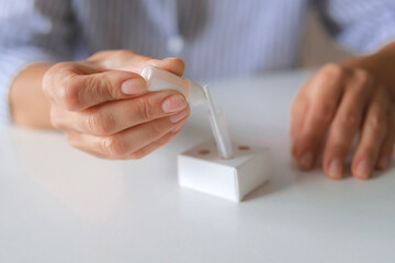 Rapid test strip in hand, respiratory virus screening, influenza, COVID-19, pneumonia, epidemic, healthcare diagnostics, infection control, home self test, copy space