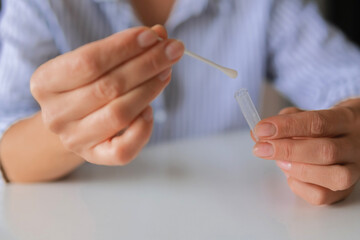 Rapid test strip in hand, respiratory virus screening, influenza, COVID-19, pneumonia, epidemic, healthcare diagnostics, infection control, home self test, copy space