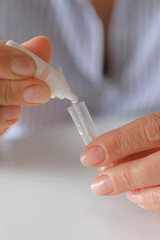 Rapid test strip in hand, respiratory virus screening, influenza, COVID-19, pneumonia, epidemic, healthcare diagnostics, infection control, home self test, copy space