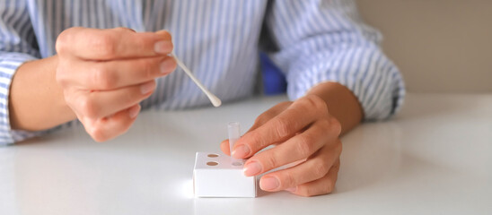 Rapid test strip in hand, respiratory virus screening, influenza, COVID-19, pneumonia, epidemic,...