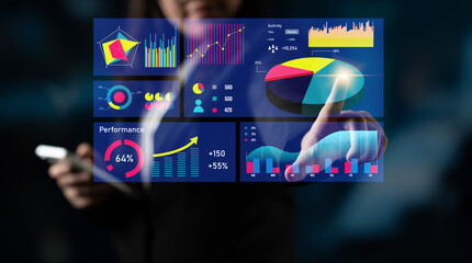 A professional interacts with a digital touchscreen displaying various data visualizations, including charts and graphs, to gain business insights and improve performance. Impute