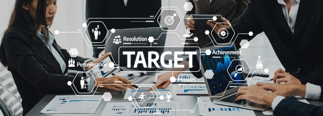Panorama shot analyst team utilizing BI Fintech to analyze financial report with laptop. Businesspeople analyzing BI data dashboard displayed on laptop screen for business insight. Prodigy Amity
