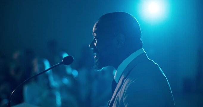 Businessman, podium and applause with audience in auditorium for presentation or speech in seminar. Man, employee or speaker with microphone or crowd clapping for workshop or corporate trade show