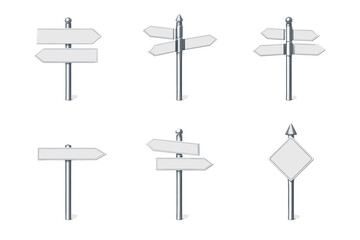 Collection of blank directional signs on metal posts against a white background