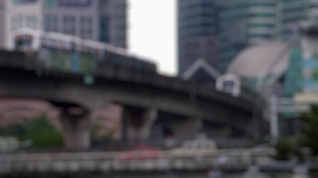 Bokeh view of moving metro train in Kuala Lumpur, Malaysia. Blurred background footage.