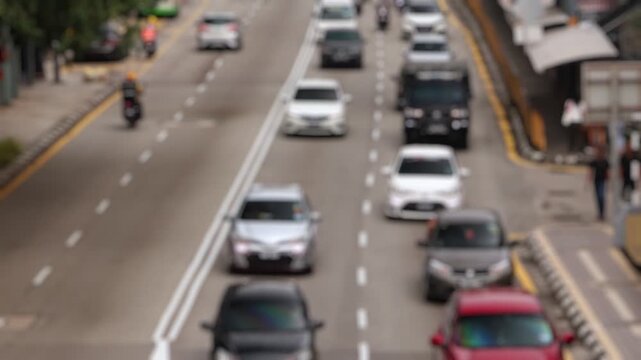 Bokeh view of road traffic in Kuala Lumpur, Malaysia. Blurred background footage.