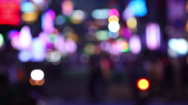 Bokeh view of busy Bui Vien Walking Street - famous New Year party area of Ho Chi Minh City (Saigon), Vietnam. Blurred background footage.