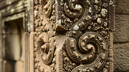 Close up of stone carvings with ornate details and architectural design