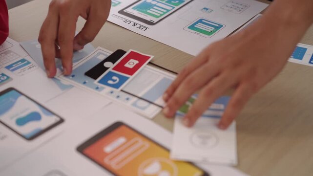 Panorama video of startup company employee planning on user interface prototype for mobile application or website in office. UX UI designer brainstorm designing user friendly interface plan. Synergic