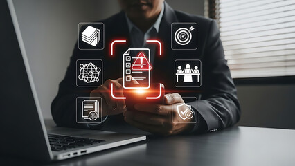 Professional man working on laptop and smartphone with compliance icons for risk assessment and data safety