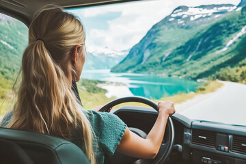 Woman traveling by rental car roadtrip in Norway Travel adventure lifestyle concept vacations outdoor mountains and fjord view