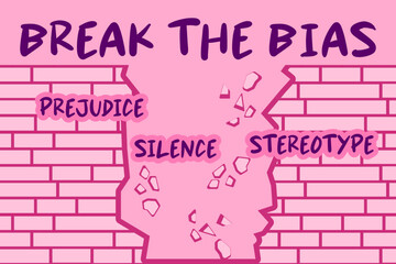 Broken brick wall with bold text &ldquo;Break the Bias&rdquo; Words prejudice, silence, stereotype. Feminist concept symbolizing women&rsquo;s empowerment and equality in pink tones. Fight for women's rights.