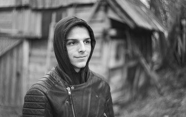 portrait of a young man with a hoodie outside