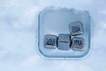 close up of stainless steel ice cubes