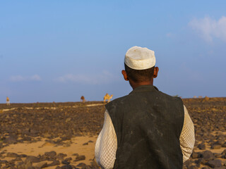 camel herder back poss