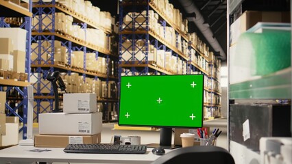 Industrial storage room with mockup chroma key on a computer, space featuring shelves, barcode scanners and packaging materials for order fulfillment. Large scale e-commerce shipment.