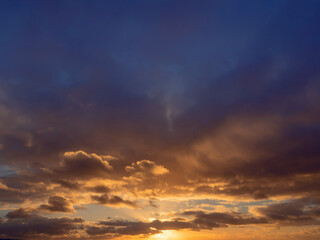 Obraz premium Dark dramatic sunset sky. Nature background for design. Strong colors.