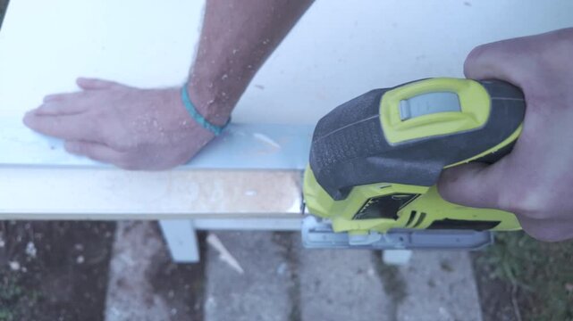 Top perpendicular view jigsaw cutting wooden door