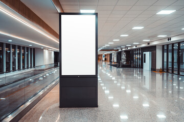 Blank vertical digital signage kiosk mockup in a modern empty airport or mall corridor, glossy reflective floor and ceiling lights, large copy space for advertising, branding or info