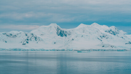 Antarctica Gerlache Strait Calm Waters Day With Mountains Covered in Snow. Remote Adventure Travel...