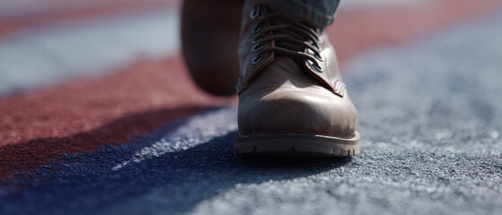 Combat boot leather tread step asphalt painted stripe closeup rugged walking with resolve, combat boot leather tread step painted asphalt stripe, gritty texture and muted tone convey tension