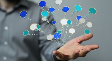 Close up of a hand holding a network of digital speech bubbles representing communication and connection.