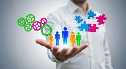 Man holding diverse family icons and interlocking gears in a bright studio setting.