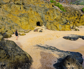 Female Tourist on Small Beach at Halona Beach Cove Near the Halona Blowhole Lookout, Oahu, Hawaii,...