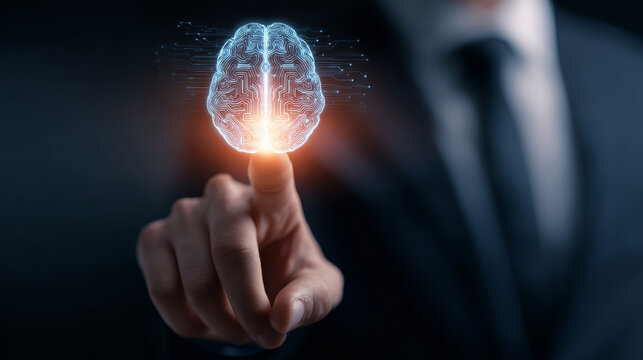 Digital brain hologram glowing above finger, symbolizing futuristic technology and intelligent innovation in business and science - Powered by Adobe