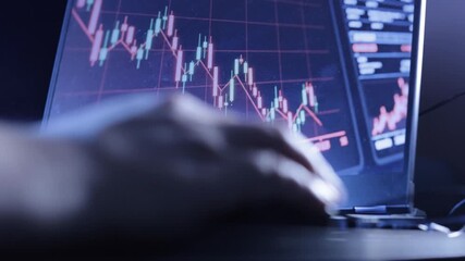 Close-Up of Falling Stock Market Graph with Hand Using Computer Mouse in Foreground - Powered by Adobe