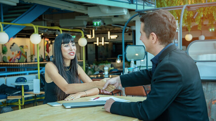 Businessman and woman are negotiating business deals, signing business contracts, celebrating business successes and partnerships, and experiencing the business world on large online platforms