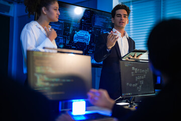 Industrial design team planning future transport strategy. Executive presenting new smart mobility concept and market trend analysis on digital board during late night workshop.