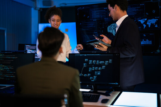 Industrial design team planning future transport strategy. Executive presenting new smart mobility concept and market trend analysis on digital board during late night workshop. - Powered by Adobe