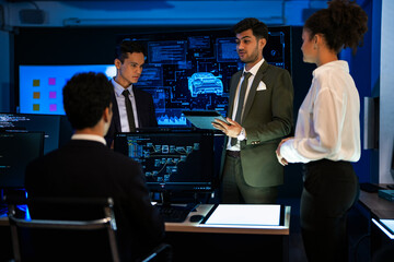 Industrial design team planning future transport strategy. Executive presenting new smart mobility concept and market trend analysis on digital board during late night workshop.