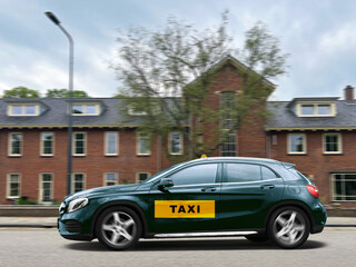 Black taxi car driving in city. Transportation service