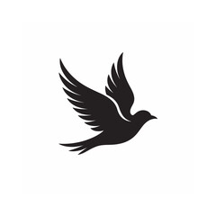 Obraz premium A striking black silhouette of a bird in flight wings gracefully spread and soaring