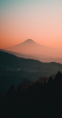 Majestic mountain peak against a soft, gradient sky.