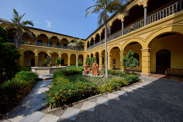 Obraz premium Silence and sunlight in the heart of Lima. The Convento de Santo Domingo offers a peaceful escape from the bustling city streets, where centuries of history are preserved in every carved wooden 