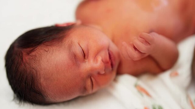 A newborn baby crying naturally, showing early emotional expressions during post-birth care. A raw and touching moment of new life.
